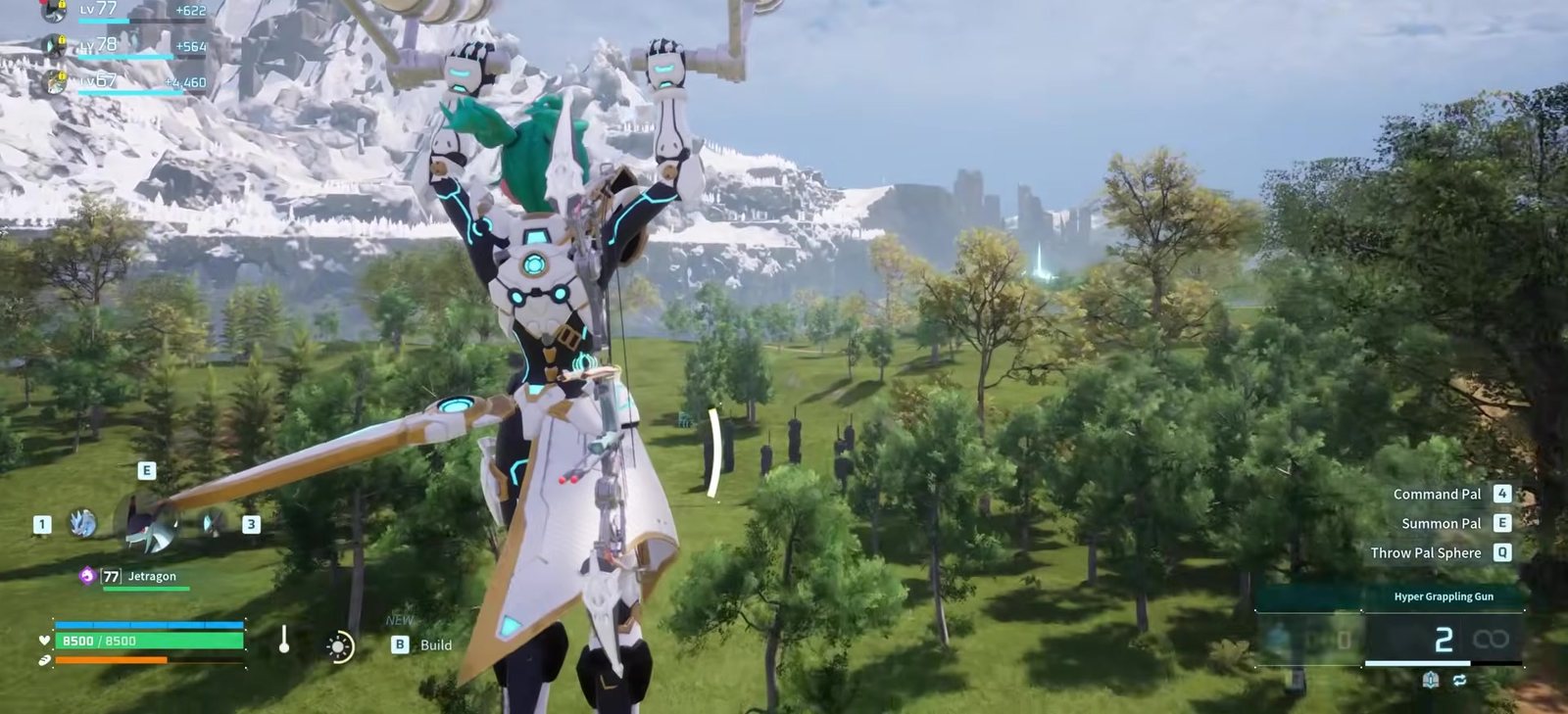 A grapple launch over green fields with snow mountains behind